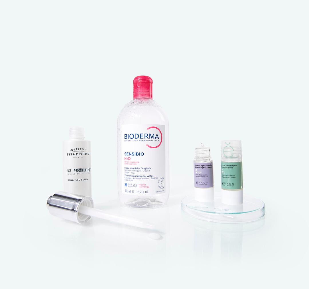 Naos brand best sellers: Bioderma Sensibio H2O micellar water, Institut Esthederm Age Proteom serum, and two Etat Pur treatments, salicylic acid and hyaluronic acid.
