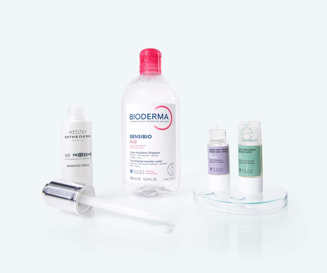 Naos brand best sellers: Bioderma Sensibio H2O micellar water, Institut Esthederm Age Proteom serum, and two Etat Pur treatments, salicylic acid and hyaluronic acid.